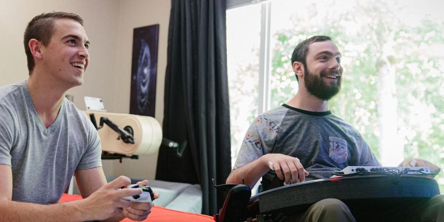 two-people-playing-with-the-xbox-adaptive-controller.jpg